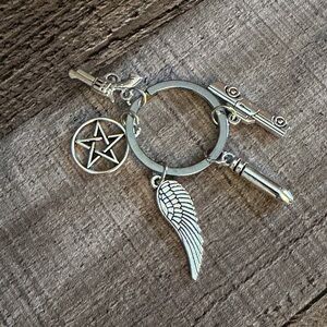 Supernatural keychain with charms. 
#supernatural
#samanddean